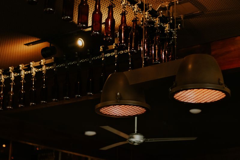 Stylish bar area inside Daves hot chicken restaurant with ambient lighting